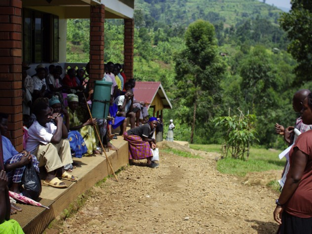 Patients waiting at the Beatrice Tierney Health Center listen to a lesson about malaria.