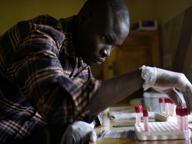 A clinic worker handles blood samples. This clinic offers something unusual for a rural clinic: a staff physician and free, rapid HIV testing each weekday.