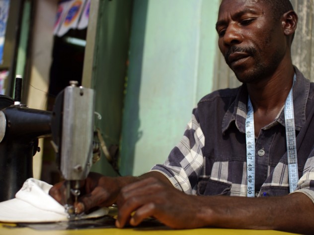 Photograph by Ian MacLellan Matia Lule works as a tailor in Mbarara. SHIP provided the loan for him to buy his sewing machine; this business helps Lule afford transportation to the clinic to get his medicines, and other living expenses.