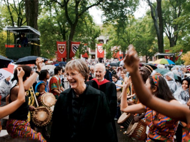 Photograph by Jim Harrison The Harvard College Pan-African Dance and Music Ensemble gives Drew Gilpin Faust, attired in Harvard’s presidential gown, a raucous welcome. President emeritus Derek Bok and James R. Houghton, Senior Fellow of the Harvard Corporation, follow her in the procession into Tercentenary Theatre.