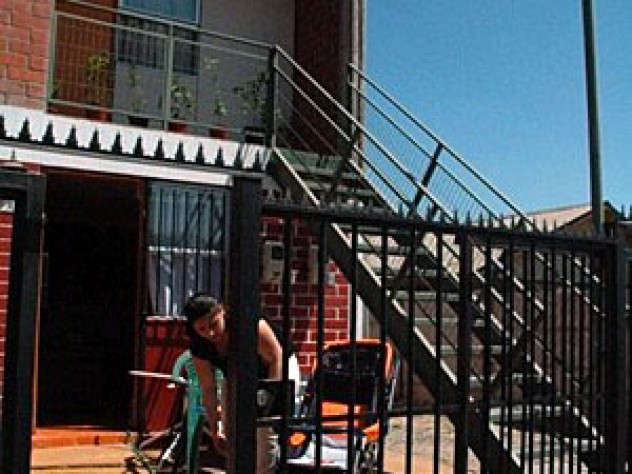 Joanna Vera’s duplex; the woman pictured is her downstairs neighbor.