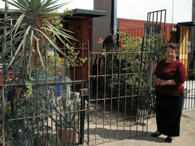 ...she has fenced in her front yard and filled it with plants, which she sells as her livelihood. And Ortega says this home, though unfinished, is a big improvement over her former makeshift home in the shantytown.