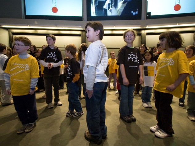 Another group of volunteers demonstrates phase changes: solid... 