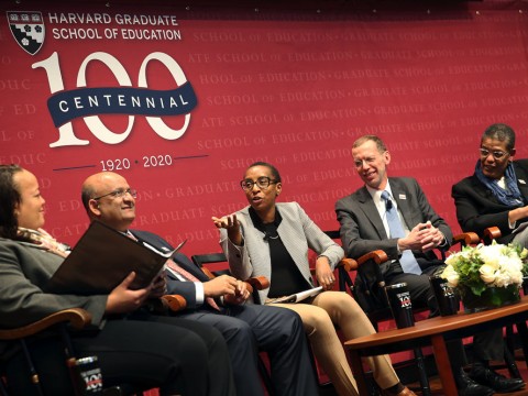 Five Harvard deans sit on stage in a panel.