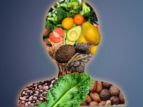 Silhouette of a human body comprised of food groups: fruit, nuts, legumes, vegetables, whole grains