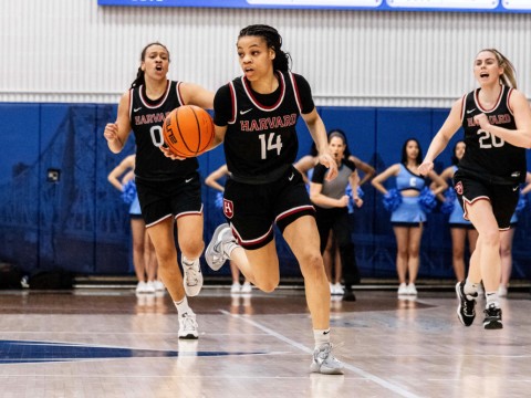 Harmoni Turner dribbles the ball up the court 