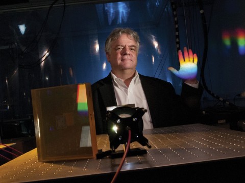 Instrument designer Andrew Szentgyorgyi illustrates the prism technology for the GMT’s high-resolution spectrograph.
