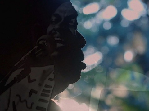 A still image from the film, This is Love, showing Rudy Love in shadowed profile
