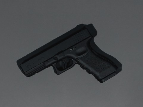 black semi automatic pistol on gray surface