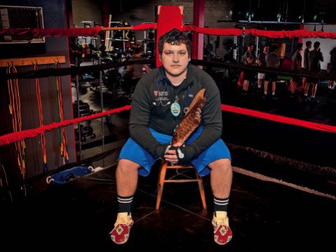 Victor A. Lopez sits in a boxing ring