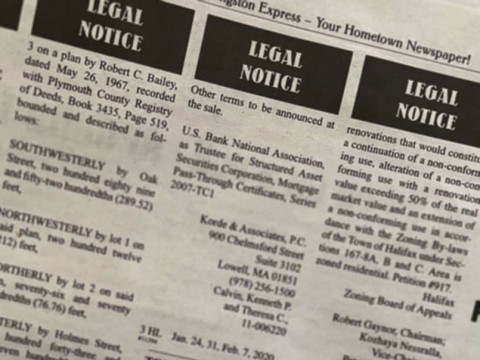 A page from a newspaper showing legal notices