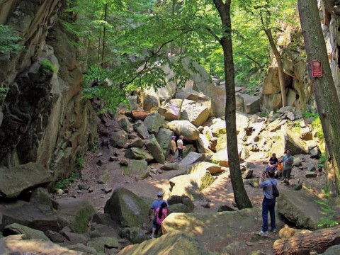 Hikers stand in Purgatory Chasm, near Worcester, Massachusetts