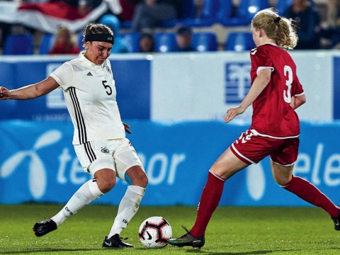 Linda Liedel (at left), representing Germany in Spain’s 2019 La Manga Tournament, competes for the ball with a Danish rival.