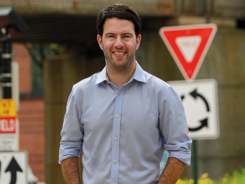 portrait photograph of Nicholas Stephanopoulos in a casual shirt and jeans