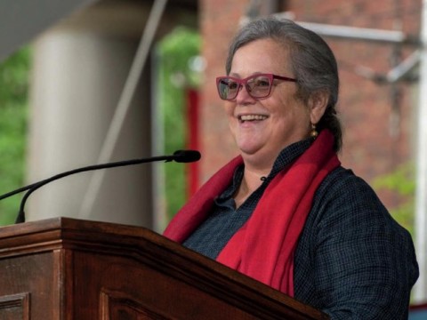 Alice Hill at podium speaking