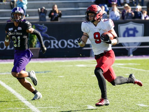 Harvard senior Cody Chrest runs with ball in hand