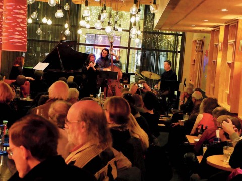 The Mad Monkfish's stage viewed from the back of a room