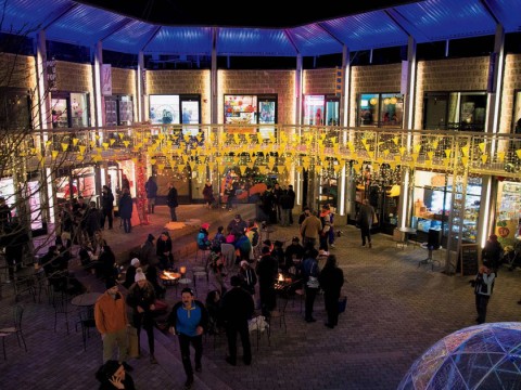 Bow Street’s festive courtyard lit up at night.