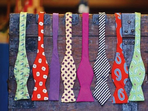 A display rack holding colorful men’s bow ties