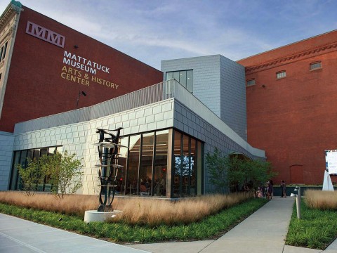 glass and steel addition to a traditional brick building that houses the Mattatuck Museum