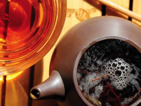 Photo of a steaming pot to tea