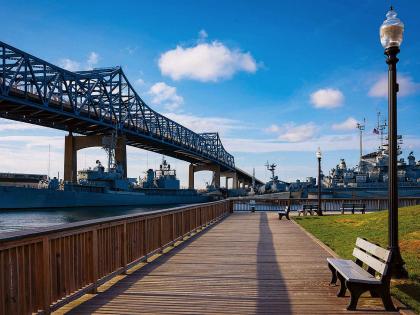 Boardwalk by Taunton River and Braga Bridge overhead