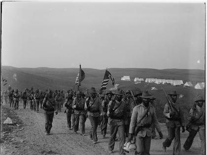 The U.S. Army's 24th Infantry Regiment, an African-American regiment, arriving at Camp Wiloff in Montauk, New York, 1898