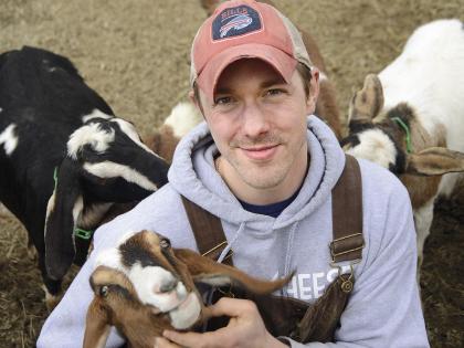 Max Sandvoss with some of his goats at the First Light Farm and Creamery in East Bethany, New York 