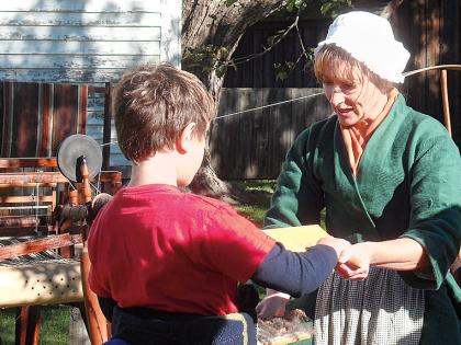 Traditional artisans, such as spinners, demonstrate their skills at Strawbery Banke.