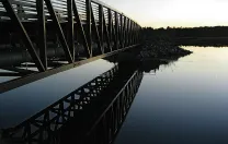 The Eastern Trail’s bike and pedestrian bridge respects the animal and bird life of the marshlands in Scarborough, Maine.