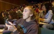 ...while Julia Pederson ’07 registers her answer with a handheld clicker...