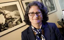 Pediatric palliative-care specialist Joanne Wolfe hangs pictures of patients in her office.