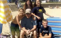 Bill Jenkins, enjoying the beach with his grandchildren last June, joined a clinical study exploring the value of early palliative care after his cancer diagnosis in 2011.