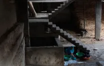 In the government-built housing, the elephants live together in a central area, where children also play and other activities take place—a safety risk.