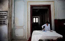In a workshop area of the palace complex that is closed to the public, seamstresses sew and iron dozens of sets of curtains for the palaces.