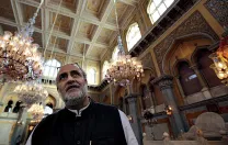 Rahul Mehrotra stands in the <i>darbar,</i> the ceremonial hall where coronations took place.