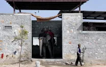 Mehrotra designed Hathigaon (“elephant village”) to house low-paid elephant keepers, their families, and their elephants. Each family’s dwelling includes an elephant “garage" with a door that opens outside, not into the inner courtyard, where children can safely play.