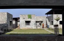 The dwellings are arranged in groups of four, oriented around a central courtyard.