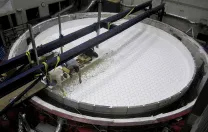 At the Steward Observatory Mirror Lab, in Tucson, staff load the rotary kiln with 20 tons of chunks of borosilicate glass.