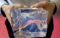 The detail shows a chunk of raw glass.