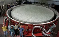 At the Steward Observatory Mirror Lab, in Tucson: with the raw glass in place, the rotary kiln can be covered and prepared for heating.