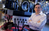 Daniel Fabricant, of the Smithsonian Astrophysical Observatory, an early leader in the GMT&rsquo;s design, appears with a spectrograph under construction in Cambridge.