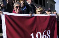 Classmates (from left to right) Ed Gotgart, Bill Barrett, and Al Raine enjoy the game.