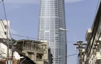 Complete with heliport, the Bitexco Tower rises over traditional Ho Chi Minh City.