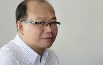 Tran Ngoc Trung Nhan, a Fulbright student who works for the My Tho municipal government (in the Mekong Delta), navigates the boundaries between private investment and public land ownership.