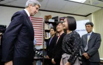 During his first visit to Vietnam as secretary of state, John Kerry met with Fulbright alumnae Tran Thuy Giang (at rear, of Tri Viet Consulting and Investment) and Dang Thi Manh (foreground, of Procter &amp; Gamble Vietnam). Faculty members present included Le Thi Quynh Tram, M.P.A. &rsquo;13 (center), and Pham Duy Nghia, a former Harvard Law School fellow (far right).
