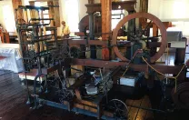 View of early mill machinery constructed of wood and metal