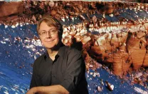 Fisher professor of natural history Andrew Knoll, curator of the Harvard University Herbaria’s paleobotanical collections.  Behind him is an outcropping of ancient sedimentary Martian rock, which he’s studied for NASA’s Mars Exploration  Rover Mission.