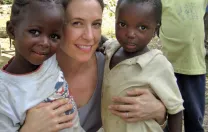 At left, Betancourt with young friends Binta and Christopher in Koidu Town, Kono District, Sierra Leone.