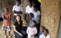 Betancourt with graduates of a FXB International program in Rwanda that has helped families reach economic self-sufficiency by starting businesses.